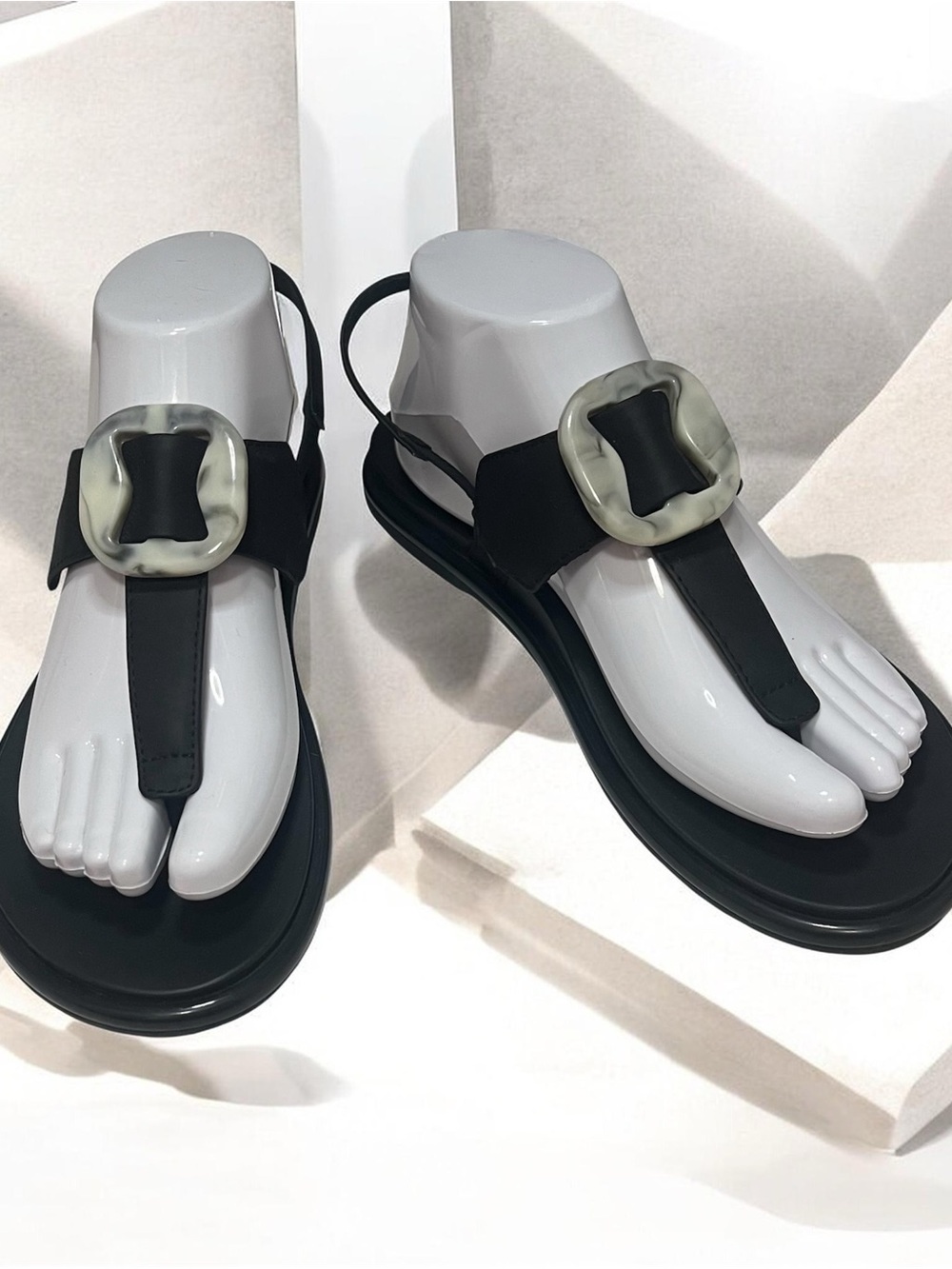 OluKai Black Thong Sandals with Translucent Ivory Buckle